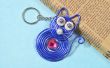 Cómo hacer lindos llaveros con hilo azul envuelto colgante gato
