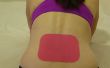 Reducir el dolor de espalda con la cinta de la kinesiología