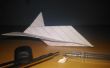 Avión de papel de tamaño de punta de pluma