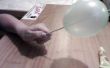 Cómo obtener una aguja a través de un globo