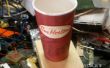 Altavoz megáfono de un café de papel taza