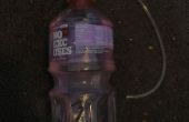 Bebedero de botella de agua de planta
