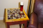 Mesa con mosaico de azulejos con incrustaciones de tapa de cristal