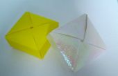 Caja de origami con las aletas que se enclavija