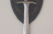 Sting - espada de Bilbo y de Frodo con montaje en pared escudo