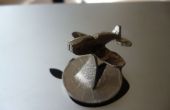 Cómo hacer un avión en miniatura de una moneda
