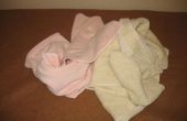 Doblar toallas en cuartos y tercios
