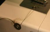 Sujeción del hilo de rosca de la máquina de coser