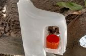Alimentador del pájaro del bricolaje de la jarra de la leche reciclada